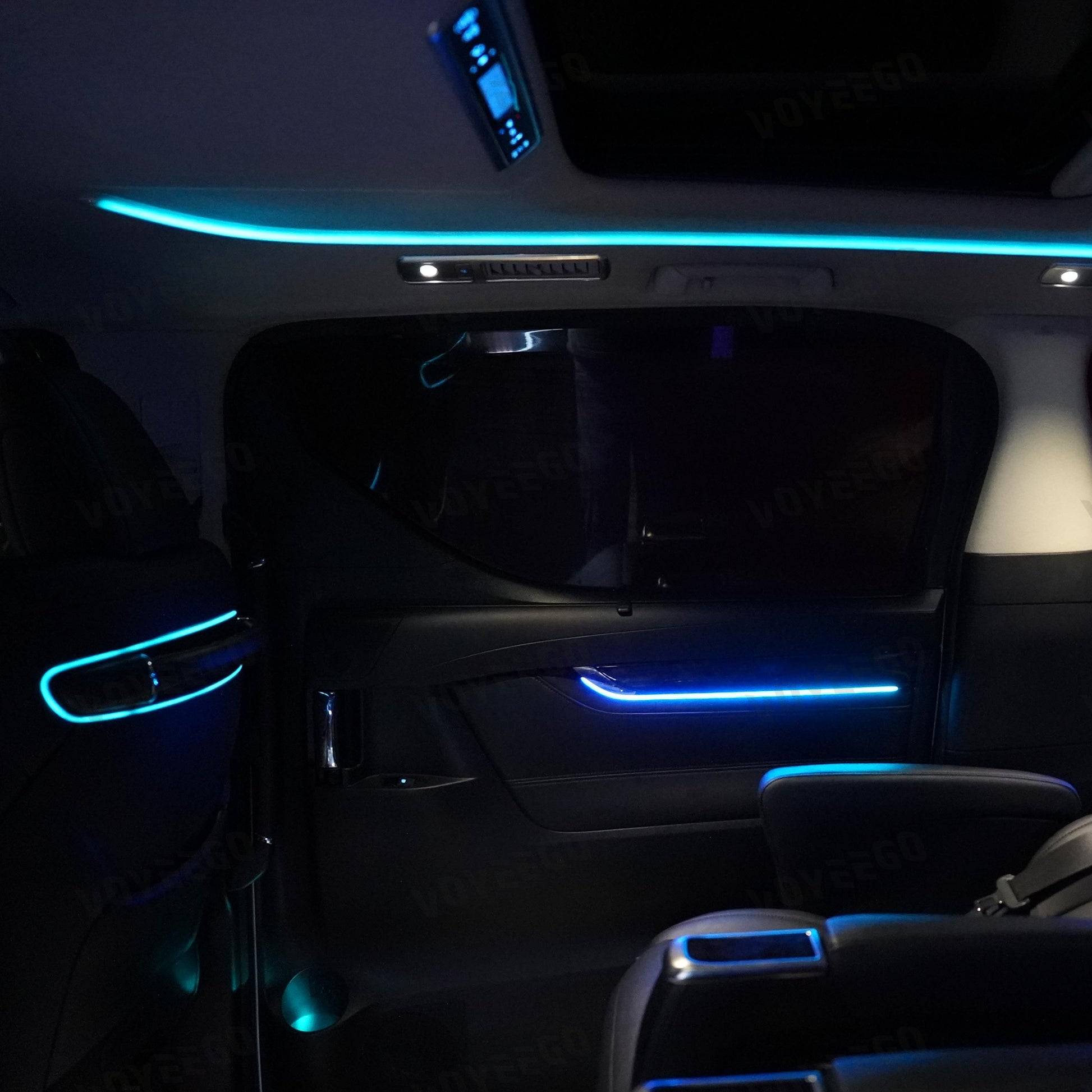 toyota alphard Car interior with blue LED strip lights in a dark setting