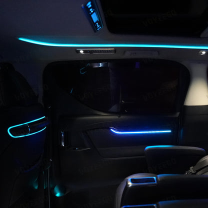 toyota alphard Car interior with blue LED strip lights in a dark setting